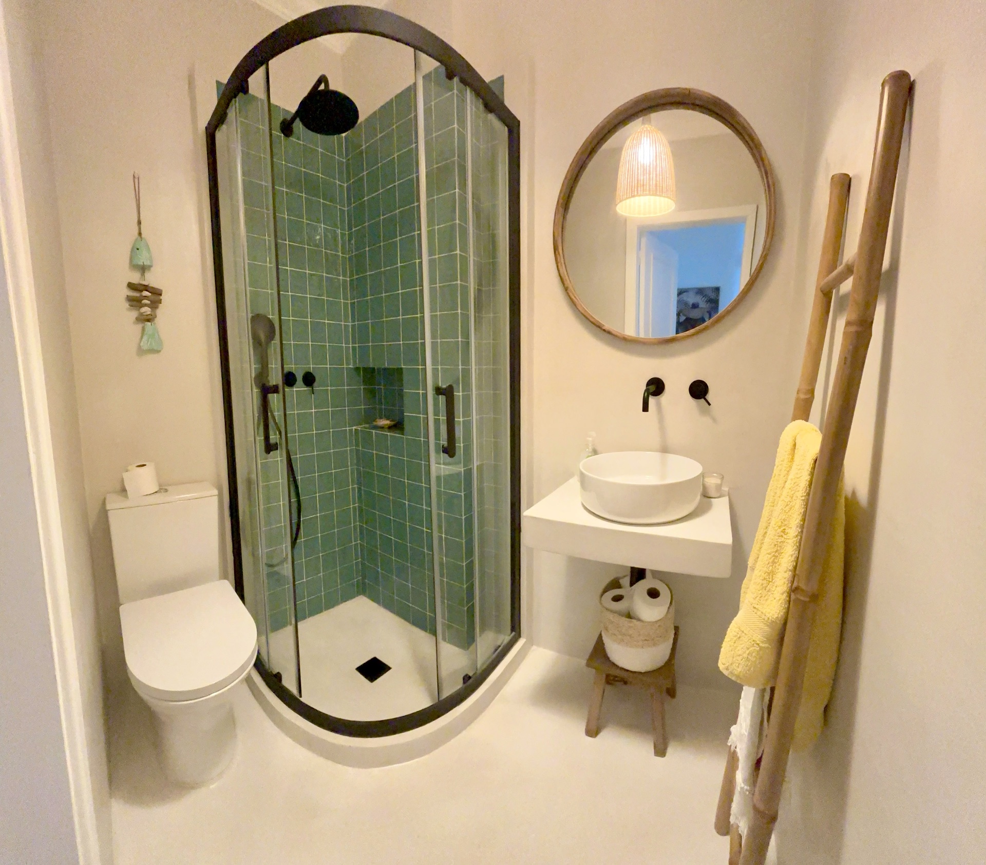 with walk-in teal green tile shower