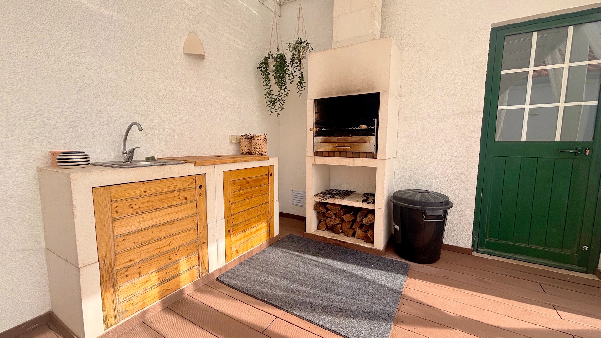 Built-in stone barbecue grill and outdoor sink